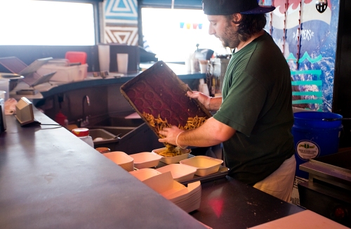 A cook at Rippers in Rockaway Beach, Queens, prepares fresh French fries.